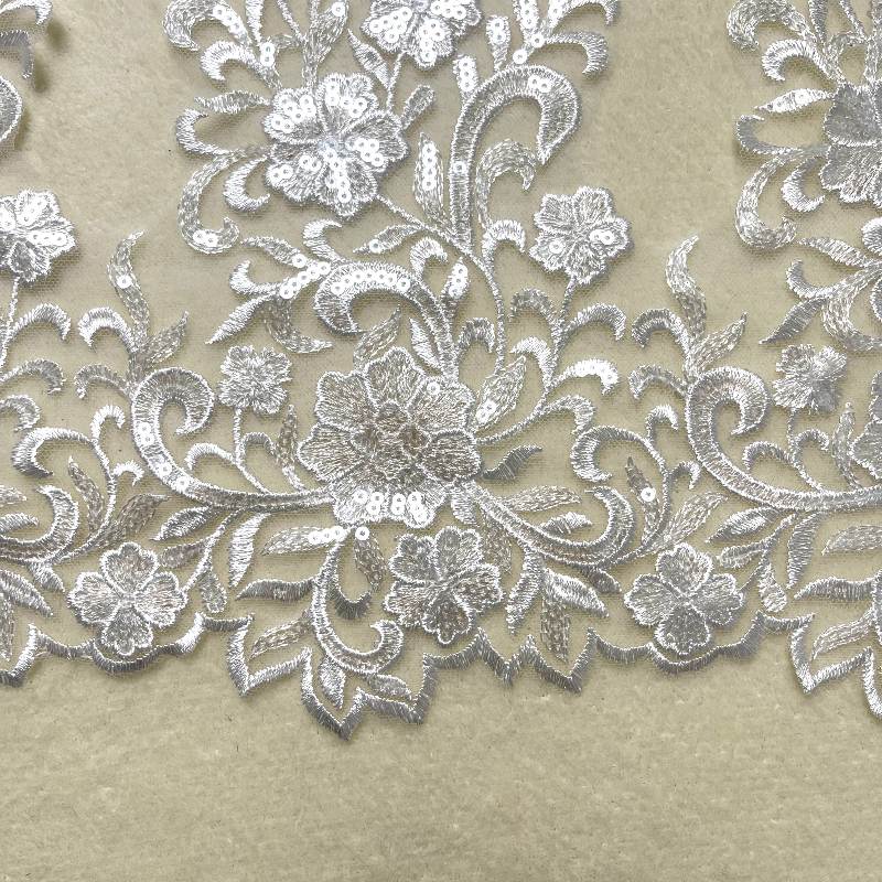 Edge embroidered white lace