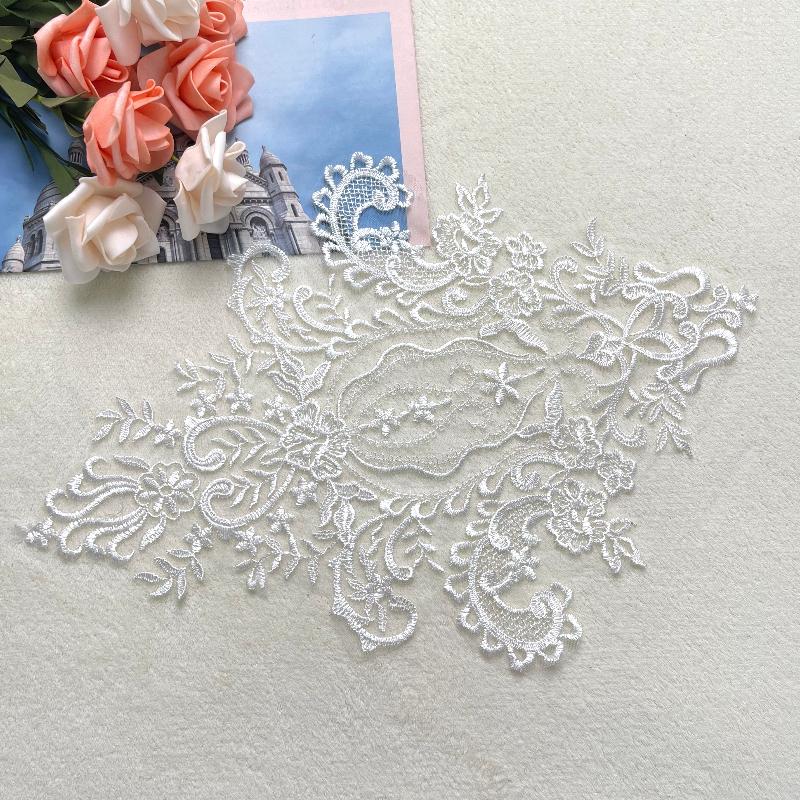 Embroidered white lace applique